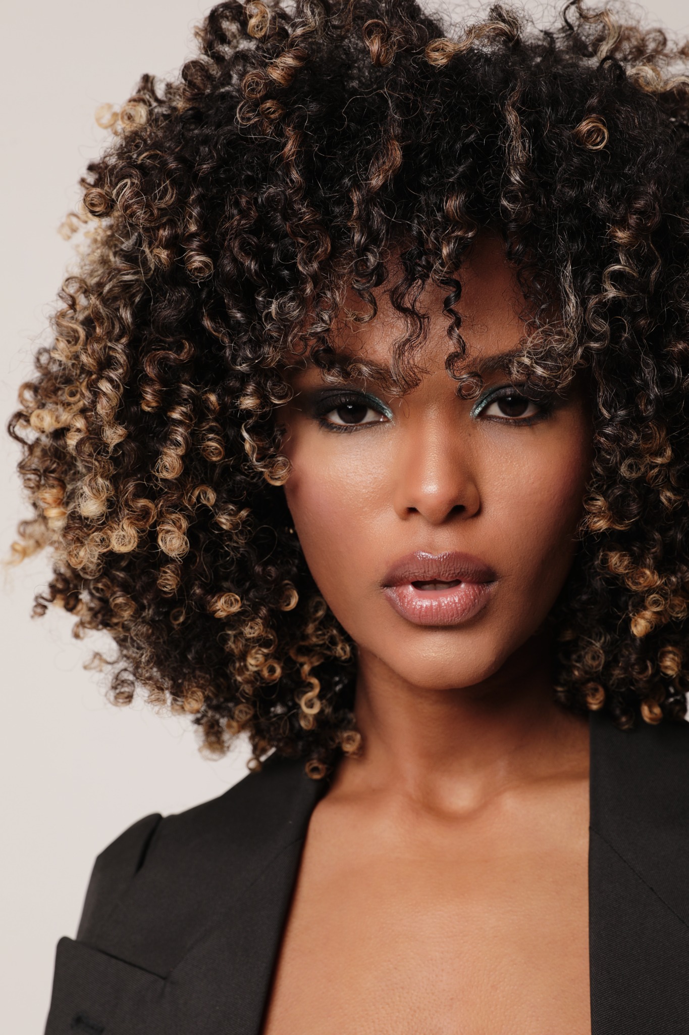Beauty editorial portrait featuring defined curls